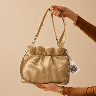 Zynara Fashion women’s textured handbag with chain shoulder strap, displayed on neutral background.