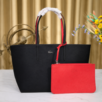 Lacoste black red tote bag showing the red reversible side