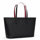 Lacoste black red tote bag showing the red reversible side