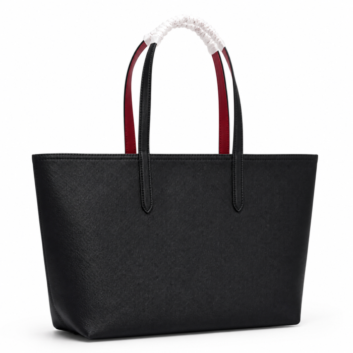 Lacoste black red tote bag showing the red reversible side